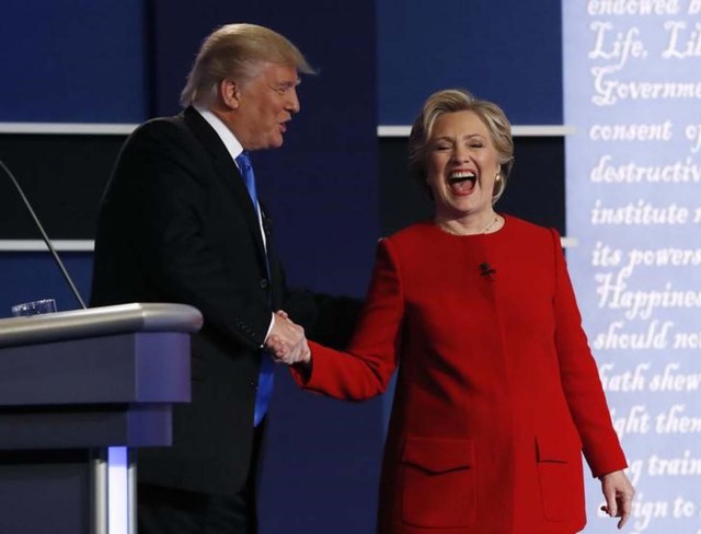 Republican U.S. presidential nominee Donald Trump greets Democratic U.S. presidential nominee Hillary Clinton after their first presidential debate at Hofstra University in Hempstead, New York, U.S., September 26, 2016.   REUTERS/Brian Snyder
