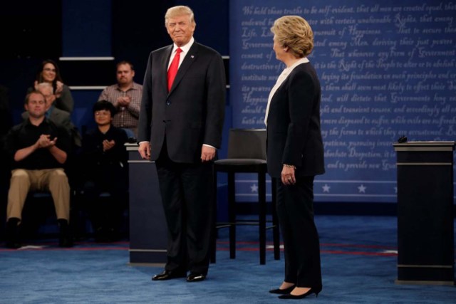 Republican U.S. presidential nominee Donald Trump and Democratic U.S. presidential nominee Hillary Clinton appear together during their presidential town hall debate at Washington University in St. Louis, Missouri, U.S., October 9, 2016. REUTERS/Mike Segar