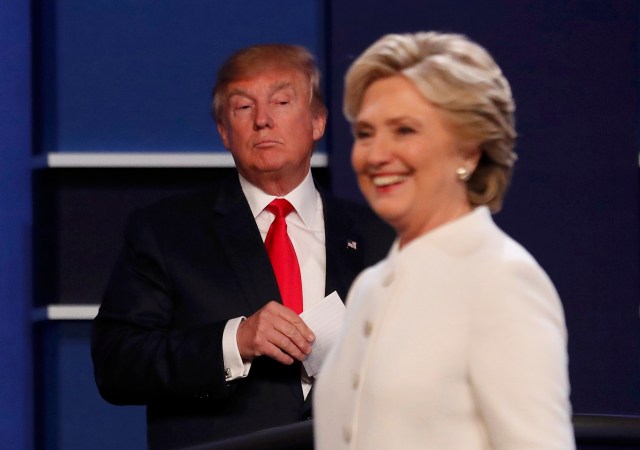 Republican U.S. presidential nominee Donald Trump and Democratic U.S. presidential nominee Hillary Clinton finish their third and final 2016 presidential campaign debate at UNLV in Las Vegas, Nevada, U.S., October 19, 2016. REUTERS/Mike Blake