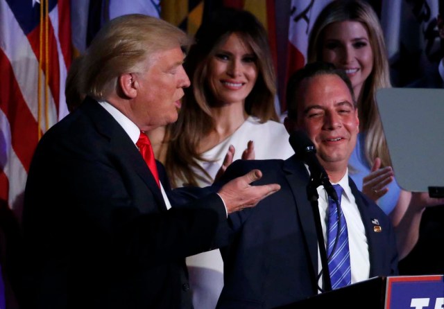 U.S. President-elect Donald Trump holds arms with Republican National Committee Chairman Reince Priebus (R) while speaking at his election night rally in Manhattan, New York, U.S., November 9, 2016.  REUTERS/Brendan McDermid