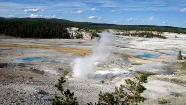 FILE - This September, 2009 file photo shows the Norris Geyser Basin in Yellowstone National Park, Wyo. Rangers are navigating a dangerous landscape where boiling water flows beneath a fragile rock crust as they search for a man who reportedly fell into a hot spring at Yellowstone National Park. Officials say the safety of park personnel was a top concern during the search in the popular Norris Geyser Basin. The man is presumed dead. (AP Photo/Beth Harpaz, File)