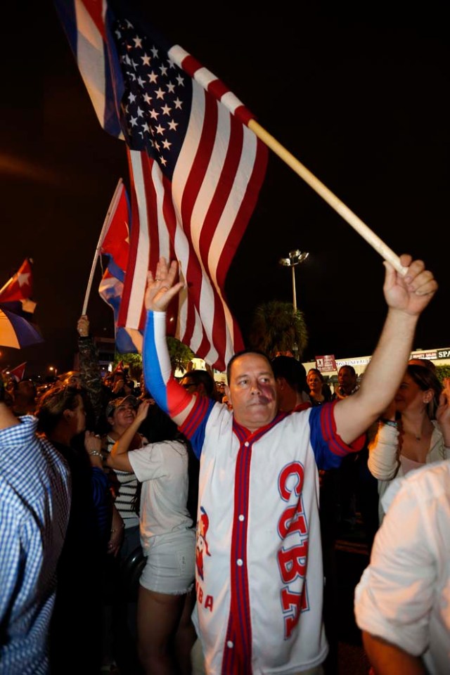 Cuban Americans celebrate upon hearing about the death of longtime Cuban leader Fidel Castro in the Little Havana neighborhood of Miami, Florida on November 26, 2016. Cuba's socialist icon and father of his country's revolution Fidel Castro died on November 25 aged 90, after defying the US during a half-century of ironclad rule and surviving the eclipse of global communism. / AFP PHOTO