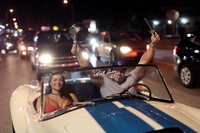 People celebrate after the announcement of the death of Cuban revolutionary leader Fidel Castro, in the Little Havana district of Miami, Florida, U.S. November 26, 2016. REUTERS/Javier Galeano