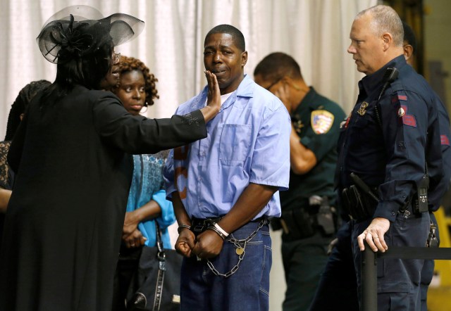 FILE PHOTO - An inmate with the Louisiana Department of Corrections is consoled by friends and family they attend the funeral of Alton Sterling, who was shot dead by police, in Baton Rouge, Louisiana, U.S. July 15, 2016. REUTERS/Jonathan Bachman/File Photo REUTERS PICTURES OF THE YEAR 2016 - SEARCH 'POY 2016' TO FIND ALL IMAGES
