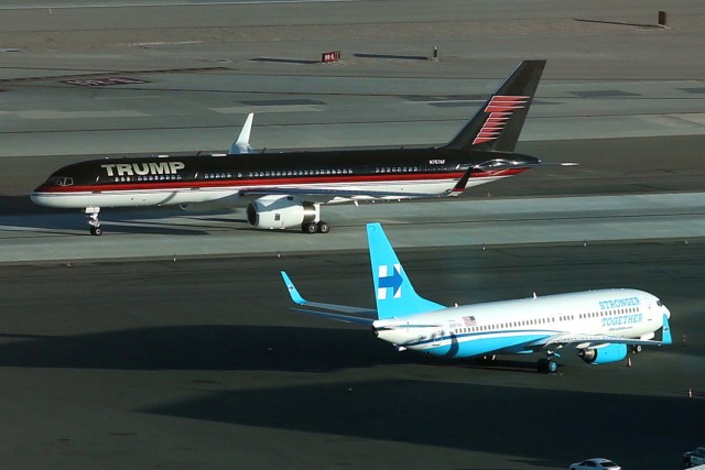 FILE PHOTO - U.S. Republican presidential nominee Donald Trump's campaign plane (rear) passes U.S. Democratic presidential nominee Hillary Clinton's campaign plane as it lands in Las Vegas, Nevada, U.S. October 18, 2016. REUTERS/Lucy Nicholson/File Photo REUTERS PICTURES OF THE YEAR 2016 - SEARCH 'POY 2016' TO FIND ALL IMAGES