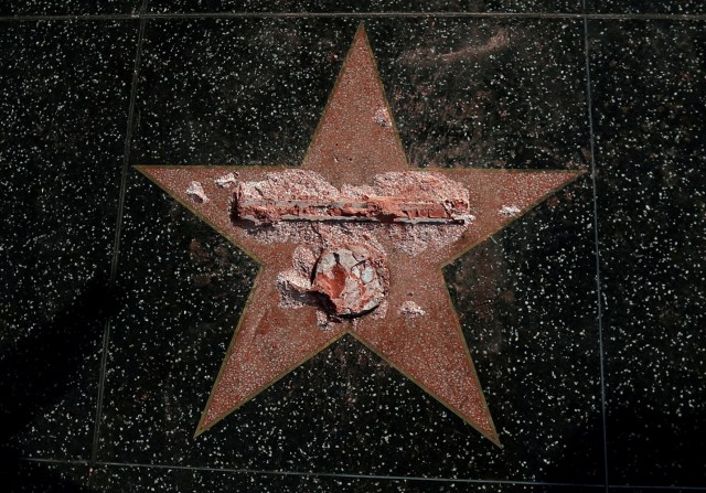 FILE PHOTO - Donald Trump's star on the Hollywood Walk of Fame is seen after it was vandalized in Los Angeles, California U.S., October 26, 2016. REUTERS/Mario Anzuoni/File Photo REUTERS PICTURES OF THE YEAR 2016 - SEARCH 'POY 2016' TO FIND ALL IMAGES