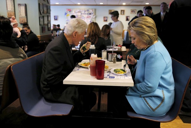 FILE PHOTO - U.S. Democratic presidential candidate Hillary Clinton and her husband, former U.S. President Bill Clinton eat breakfast at the Chez Vachon restaurant in Manchester, New Hampshire February 8, 2016. REUTERS/Brian Snyder/File Photo REUTERS PICTURES OF THE YEAR 2016 - SEARCH 'POY 2016' TO FIND ALL IMAGES