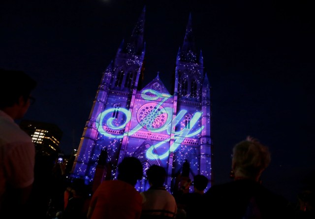 A Christmas-themed projection illuminates the facade of Sydney's St Mary's Cathedral on the opening night of the Catholic church's celebration of the Christmas season in Australia, December 8, 2016. REUTERS/Jason Reed FOR EDITORIAL USE ONLY. NO RESALES. NO ARCHIVES.