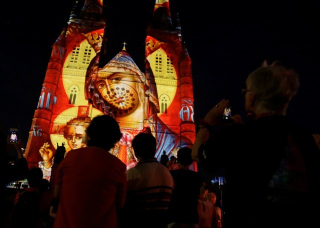 A Christmas-themed projection featuring Mary and baby Jesus illuminates the facade of Sydney's St Mary's Cathedral on the opening night of the Catholic church's celebration of the Christmas season in Australia, December 8, 2016. REUTERS/Jason Reed FOR EDITORIAL USE ONLY. NO RESALES. NO ARCHIVES.