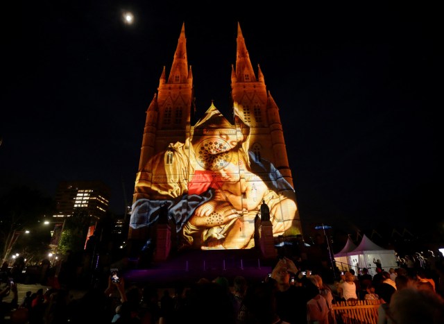 A Christmas-themed projection featuring Mary and baby Jesus illuminates the facade of Sydney's St Mary's Cathedral on the opening night of the Catholic church's celebration of the Christmas season in Australia, December 8, 2016. REUTERS/Jason Reed FOR EDITORIAL USE ONLY. NO RESALES. NO ARCHIVES.