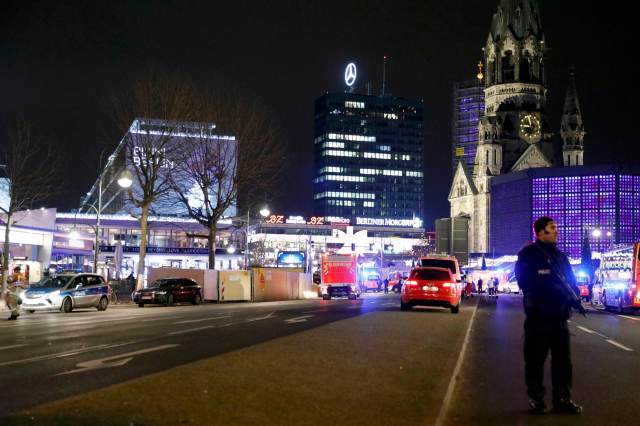 Police stand near the Christmas market in Berlin
