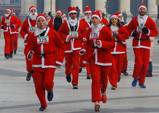 Runners dressed as Santa Claus take part in the annual Christmas race on the streets of Skopje, Macedonia December 25, 2016. REUTERS/Ognen Teofilovski