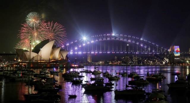 Fireworks explode over the Sydney Opera House and Harbour Bridge during an early evening display in the lead up to the main New Year's Eve fireworks in Sydney, Australia, December 31, 2016. REUTERS/Jason Reed