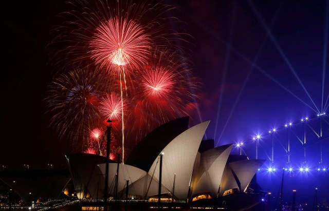 Fireworks explode over the Sydney Opera House during an early evening display in the lead up to the main New Year's Eve fireworks in Sydney, Australia, December 31, 2016. REUTERS/Jason Reed