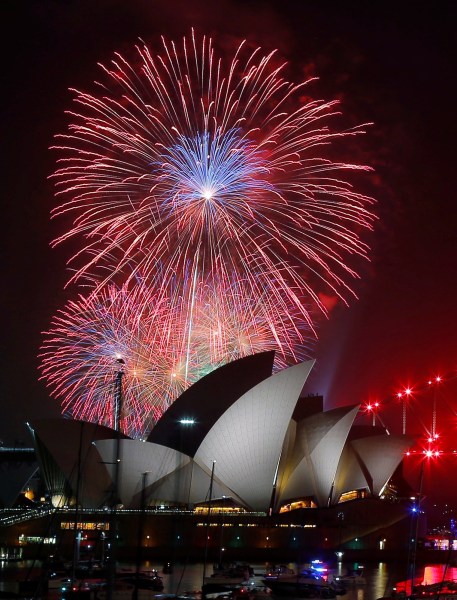 Fireworks explode over the Sydney Opera House during an early evening display in the lead up to the main New Year's Eve fireworks in Sydney, Australia, December 31, 2016. REUTERS/Jason Reed