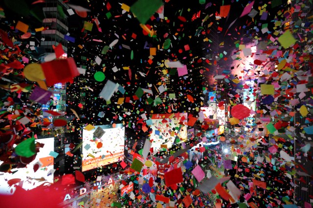 Confetti falls as the clock strikes midnight during New Year celebrations in Times Square in New York, January 1, 2017. REUTERS/Mark Kauzlarich