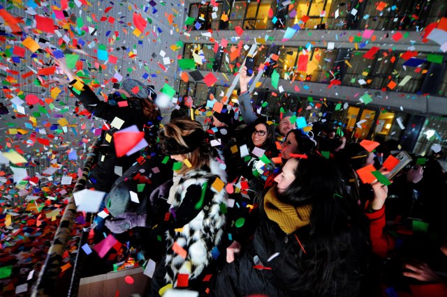 Revelers celebrate as confetti falls just after midnight during New Year celebrations in Times Square in New York, January 1, 2017. REUTERS/Mark Kauzlarich