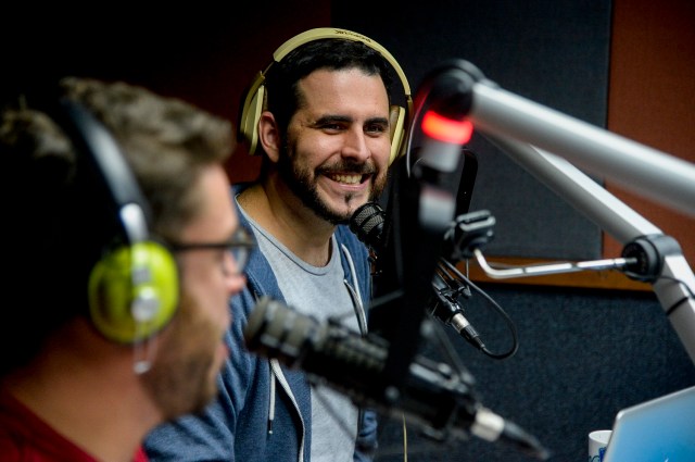 Radio hosts Jose Rafael Guzman (L) and Manuel Silva speak during the broadcast of the "Calma Pueblo" show in Caracas on December 6, 2016. Although basic goods may be lacking in crisis-stricken Venezuela, what is not in short supply is humor, not only as a form of evasion but also as a way to channel criticism against the government of Nicolás Maduro. / AFP PHOTO / FEDERICO PARRA / TO GO WITH AFP STORY BY CAROLA SOLE