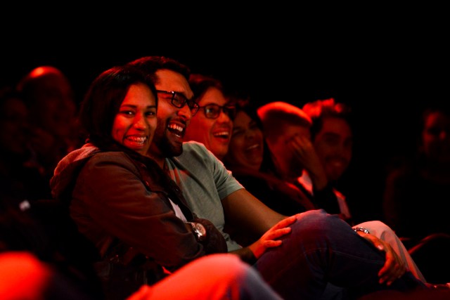 People watch Venezuelan comedian Veronica Gomez perform stand-up comedy at the theater of the BOD Cultural Center in Caracas on December 9, 2016. Although basic goods may be lacking in crisis-stricken Venezuela, what is not in short supply is humor, not only as a form of evasion but also as a way to channel criticism against the government of Nicolás Maduro. / AFP PHOTO / FEDERICO PARRA / TO GO WITH AFP STORY BY CAROLA SOLE