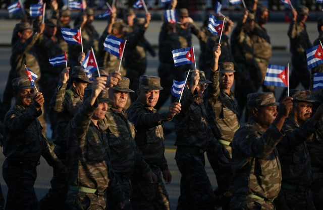 Soldiers march to mark the Armed Forces Day and commemorate the landing of the yacht Granma, which brought the Castro brothers, Ernesto "Che" Guevara and others from Mexico to Cuba to start the revolution in 1959, in Havana, Cuba, January 2, 2017. REUTERS/Alexandre Meneghini