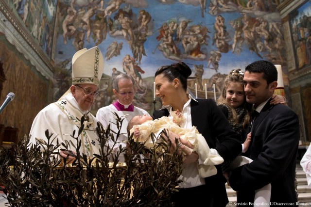 Pope Francis baptizes a baby during a ceremony in the Sistine Chapel at the Vatican January 8, 2017. Osservatore Romano/Handout via Reuters ATTENTION EDITORS - THIS IMAGE WAS PROVIDED BY A THIRD PARTY. EDITORIAL USE ONLY. NO RESALES. NO ARCHIVE.