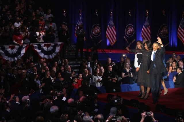 CHICAGO, IL - JANUARY 10: President Barack Obama with his wife Michelle and daughter Malia greets the crowd the crowd following his farewell speech to the nation on January 10, 2017 in Chicago, Illinois. President-elect Donald Trump will be sworn in the as the 45th president on January 20. Scott Olson/Getty Images/AFP