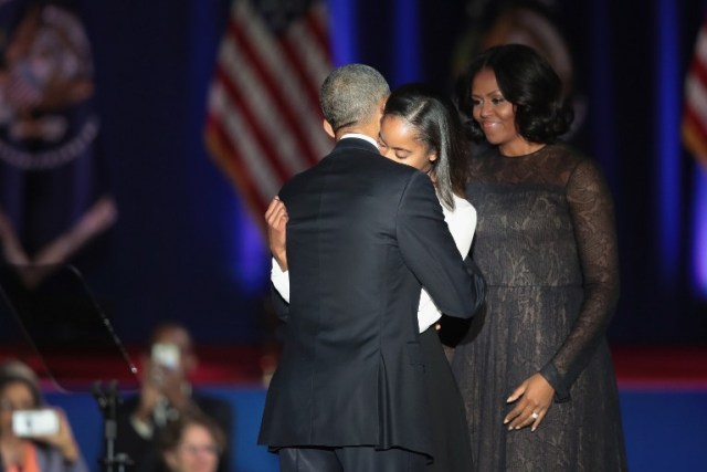 CHICAGO, IL - JANUARY 10: President Barack Obama greets his wife Michelle and daughter Malia following his farewell speech to the nation on January 10, 2017 in Chicago, Illinois. President-elect Donald Trump will be sworn in the as the 45th president on January 20. Scott Olson/Getty Images/AFP