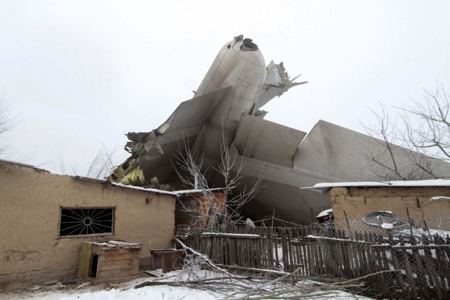 Plane debris is seen at the crash site of a Turkish cargo jet near Kyrgyzstan's Manas airport outside Bishkek, January 16, 2017.  REUTERS/Vladimir Pirogov