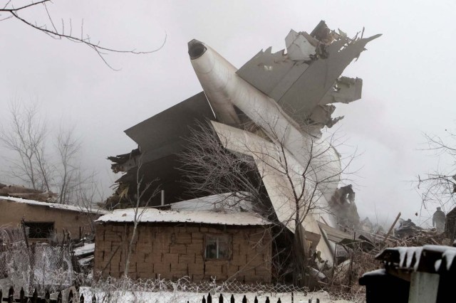 Plane debris is seen at the crash site of a Turkish cargo jet near Kyrgyzstan's Manas airport outside Bishkek, January 16, 2017. REUTERS/Vladimir Pirogov     TPX IMAGES OF THE DAY