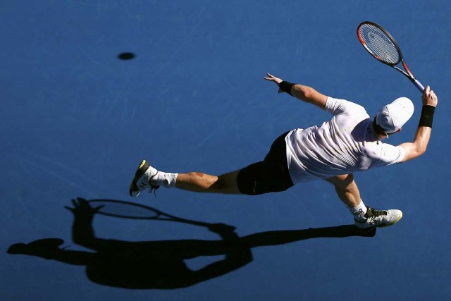 Tennis - Australian Open - Melbourne Park, Melbourne, Australia - 16/1/17 Britain's Andy Murray casts a shadow as he hits a shot during his Men's singles first round match against Ukraine's Illya Marchenko. REUTERS/Thomas Peter