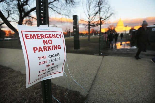 WASHINGTON, DC - JANUARY 18: A No Parking sign is displayed as the sun sets on the West Front of the U.S. Capitol building ahead of inauguration ceremonies for President-elect Donald Trump on January 18, 2017 in Washington, DC. Trump will be sworn in as the 45th U.S, president on January 20.   Mario Tama/Getty Images/AFP