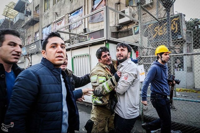 A firefighter reacts at the site of a collapsed high-rise building in Tehran, Iran January 19, 2017. Tasnim News Agency/Handout via REUTERS ATTENTION EDITORS - THIS PICTURE WAS PROVIDED BY A THIRD PARTY. FOR EDITORIAL USE ONLY. NO RESALES. NO ARCHIVE.