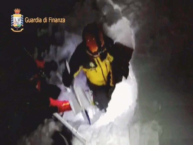 A photo taken from a video shows a rescuer entering the Hotel Rigopiano in Farindola, central Italy, hit by an avalanche, in this January 19, 2017 handout picture provided by Italy's Finance Police. Guardia Di Finanza/Handout via REUTERS   ATTENTION EDITORS - THIS IMAGE WAS PROVIDED BY A THIRD PARTY. EDITORIAL USE ONLY.