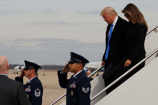 U.S. President-elect Donald Trump and his wife Melania Trump arrive aboard a U.S. Air Force jet at Joint Base Andrews, Maryland, U.S. January 19, 2017. REUTERS/Jonathan Ernst