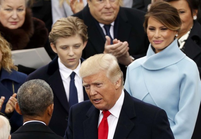 President-elect Donald Trump talks with outgoing President Barack Obama during inauguration ceremonies on the West front of the U.S. Capitol in Washington, U.S., January 20, 2017. REUTERS/Kevin Lamarque