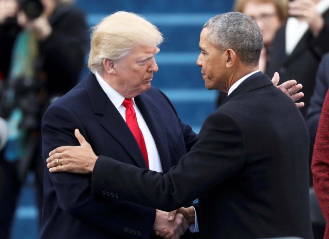 President Barack Obama (R) greets President elect Donald Trump at inauguration ceremonies swearing in Donald Trump as the 45th president of the United States on the West front of the U.S. Capitol in Washington, U.S., January 20, 2017. REUTERS/Carlos Barria TPX IMAGES OF THE DAY