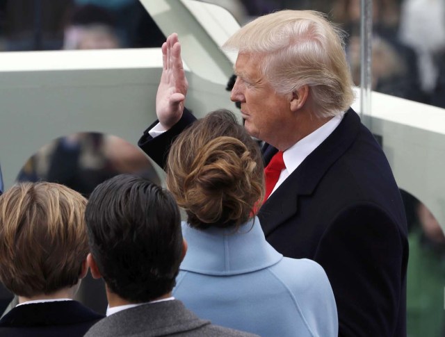 Incoming U.S. President Donald Trump takes the oath of office, accompanied by his wife Melania and sons Donald Jr and Barron (L) during inauguration ceremonies swearing in him as the 45th president of the United States on the West front of the U.S. Capitol in Washington, U.S., January 20, 2017. REUTERS/Brian Snyder