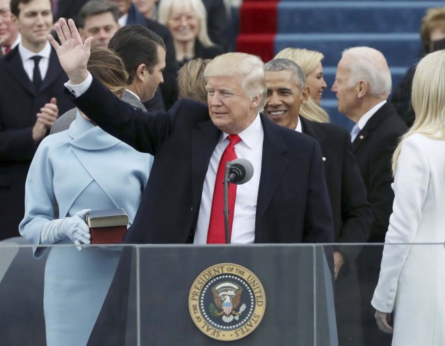 President Donald Trump waves after taking the oath at inauguration ceremonies swearing in Trump as the 45th president of the United States on the West front of the U.S. Capitol in Washington, U.S., January 20, 2017. REUTERS/Carlos Barria