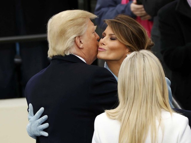 US President Donald Trump is congratulated by his wife Melania after taking the oath of office during his inauguration at the U.S. Capitol in Washington, U.S., January 20, 2017. REUTERS/Kevin Lamarque