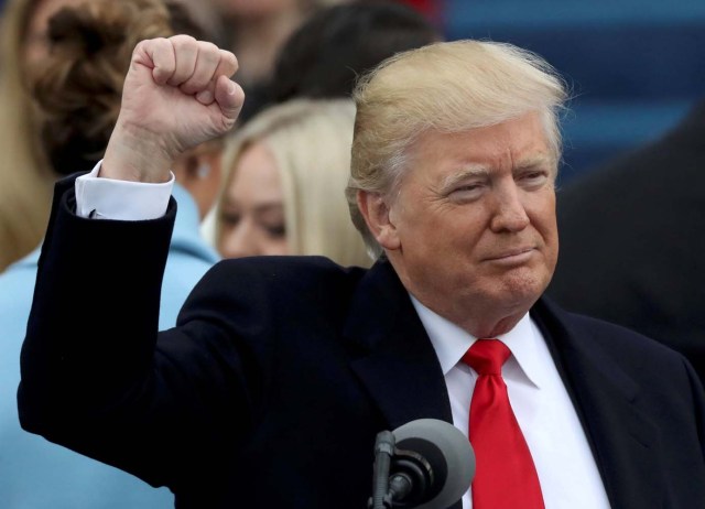 U.S. Donald Trump raises his fist after being sworn in as the 45th president of the United States on the West front of the U.S. Capitol in Washington, U.S., January 20, 2017. REUTERS/Carlos Barria
