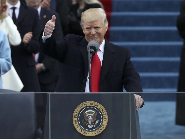 U.S. President Donald Trump gives a thumbs up after being sworn in as the 45th president of the United States on the West front of the U.S. Capitol in Washington, U.S., January 20, 2017. REUTERS/Carlos Barria
