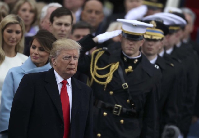 Members of the military salute as U.S. President Donald Trump attends his inauguration ceremonies at the U.S. Capitol in Washington, U.S., January 20, 2017. REUTERS/Carlos Barria