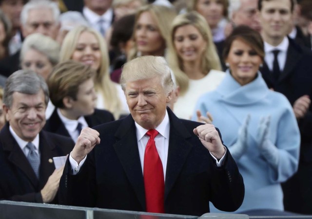 President Donald Trump celebrates after inauguration ceremonies swearing him in as the 45th president of the United States on the West front of the U.S. Capitol in Washington, U.S., January 20, 2017. REUTERS/Carlos Barria (UNITED STATES - Tags: POLITICS)