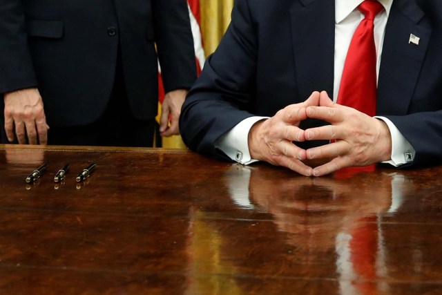 U.S. President Donald Trump waits to sign his first executive orders in the Oval Office at the White House in Washington, U.S. January 20, 2017. REUTERS/Jonathan Ernst