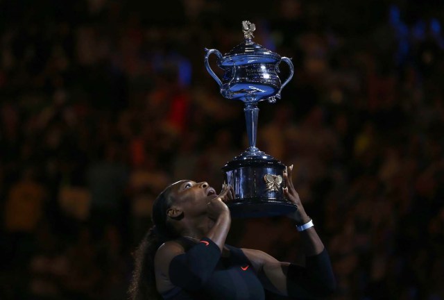 Tennis - Australian Open - Melbourne Park, Melbourne, Australia - 28/1/17 Serena Williams of the U.S. holds her trophy after winning her Women's singles final match against Venus Williams of the U.S. .REUTERS/Thomas Peter   TPX IMAGES OF THE DAY
