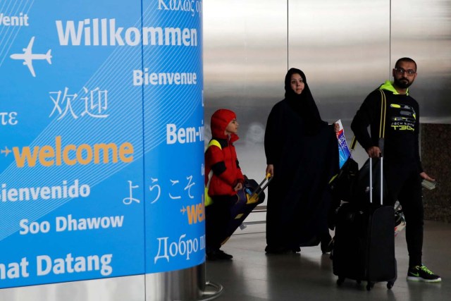 People exit immigration after arriving from Dubai on Emirates Flight 203 at John F. Kennedy International Airport in Queens, New York, U.S., January 28, 2017.  REUTERS/Andrew Kelly