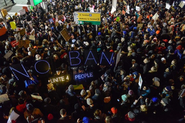 NEW YORK, NY - JANUARY 28: Protestors rally during a demonstration against the Muslim immigration ban at John F. Kennedy International Airport on January 28, 2017 in New York City. President Trump signed the controversial executive order that halted refugees and residents from predominantly Muslim countries from entering the United States. Stephanie Keith/Getty Images/AFP