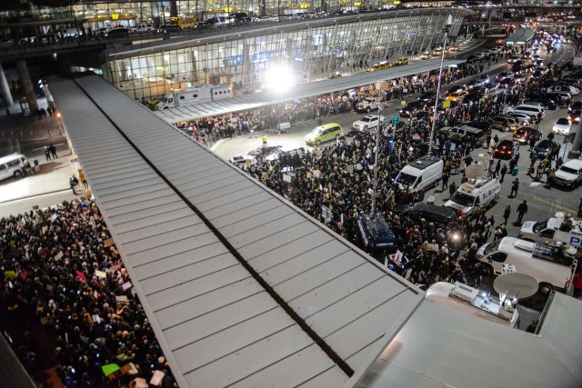NEW YORK, NY - JANUARY 28: Protestors rally during a demonstration against the new immigration ban issued by President Donald Trump at John F. Kennedy International Airport on January 28, 2017 in New York City. President Trump signed the controversial executive order that halted refugees and residents from predominantly Muslim countries from entering the United States. Stephanie Keith/Getty Images/AFP