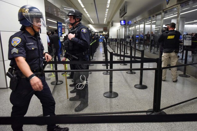 Police block a security check point inside Terminal 4 at San Francisco International Airport in San Francisco, California, U.S., January 28, 2017. REUTERS/Kate Munsch