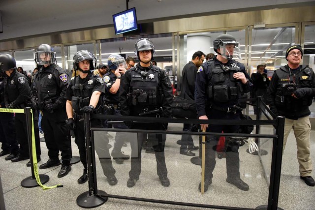 Police block a security check point inside Terminal 4 at San Francisco International Airport in San Francisco, California, U.S., January 28, 2017. REUTERS/Kate Munsch